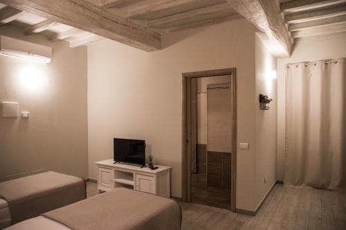 TV a/nebo společenská místnost v ubytování L’infinito residence