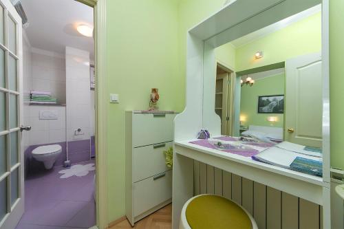a bathroom with a sink and a toilet at Villa Palma Apartments in Makarska