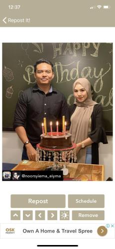 a man and woman standing in front of a cake with candles at The Best Hotel in Bayan Lepas - THE LOV PENANG in Bayan Lepas