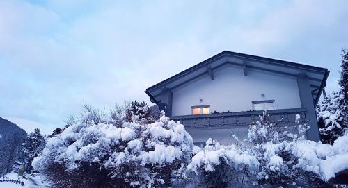 a building with a balcony in the snow at Residence Alba Montis in Bad Kleinkirchheim