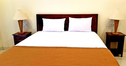 Letto o letti in una camera di Eddys Cottages & Villa