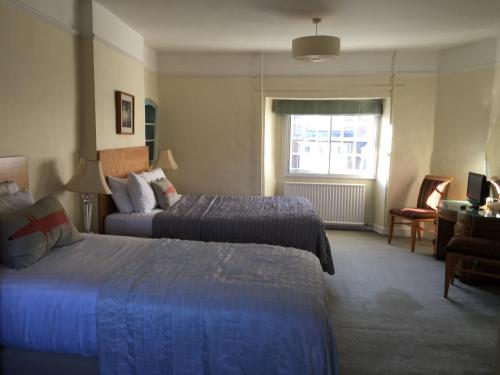 Katil atau katil-katil dalam bilik di The Queen Hotel