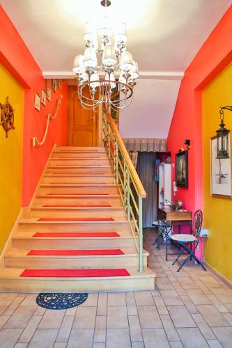 a staircase in a house with colorful walls at Willa 4 Pory Roku & Uznam in Świnoujście