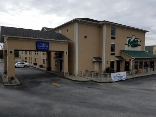 a hotel with a parking lot in front of it at Baymont by Wyndham Grovetown Augusta in Augusta