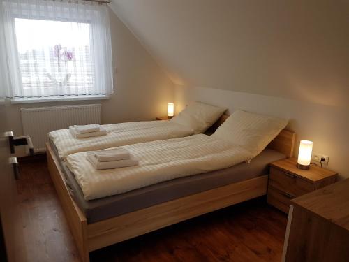 מיטה או מיטות בחדר ב-Dom pod Orzechem