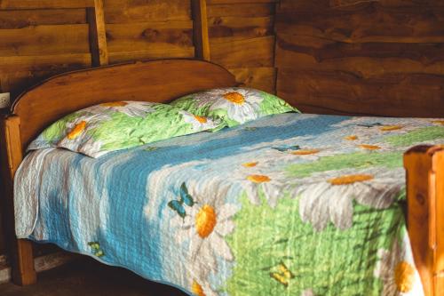 Ένα ή περισσότερα κρεβάτια σε δωμάτιο στο Ecolodge Rain