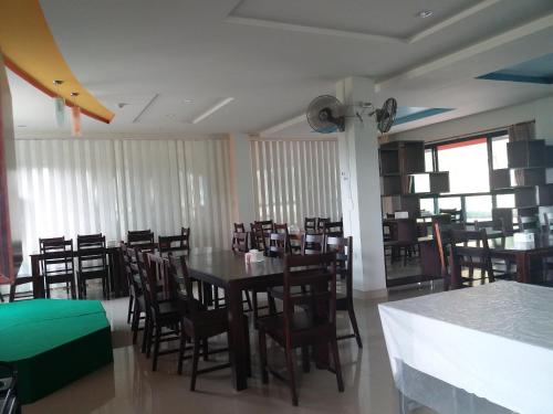 a dining room with a table and chairs at Kradang Nga Boutique Inn in Khun Han