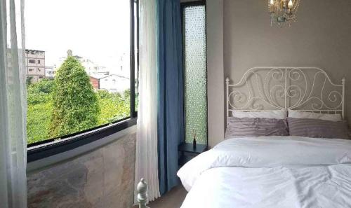 Ένα ή περισσότερα κρεβάτια σε δωμάτιο στο Wang Lang Hostel