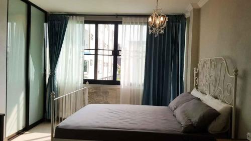 Ένα ή περισσότερα κρεβάτια σε δωμάτιο στο Wang Lang Hostel