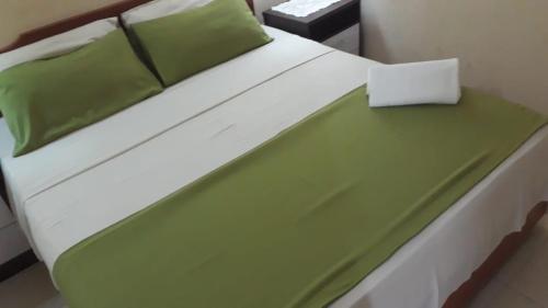 เตียงในห้องที่ Hotel del Sur