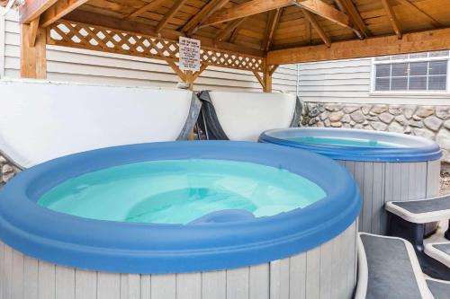 a jacuzzi tub sitting in the back at Ramada by Wyndham Frisco in Frisco