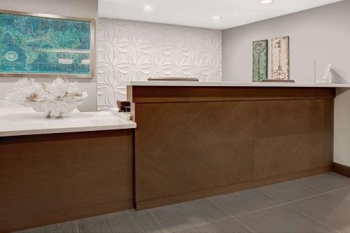 a kitchen with a counter with a vase on it at Wingate by Wyndham Richardson in Richardson