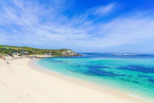 a beach with a white sand and blue water at By the Sea Margaret River in Gnarabup