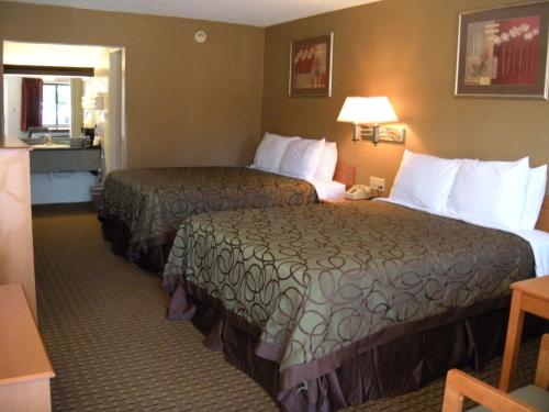 Un pat sau paturi într-o cameră la Motel West