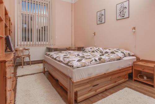 Krevet ili kreveti u jedinici u objektu Anker Apartman Kaposvár