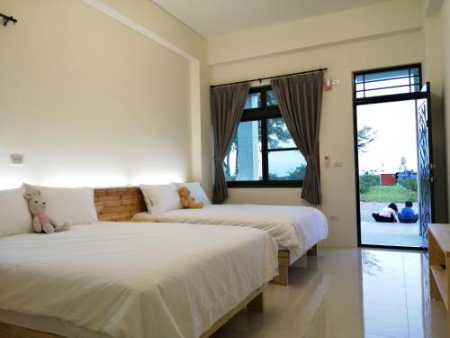 Voodi või voodid majutusasutuse 日月山水民宿 台東縣民宿1495號 toas