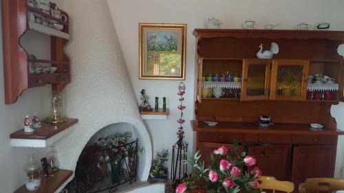 a living room with a stair case and a shelf at Attico Bouganville in Magomadas
