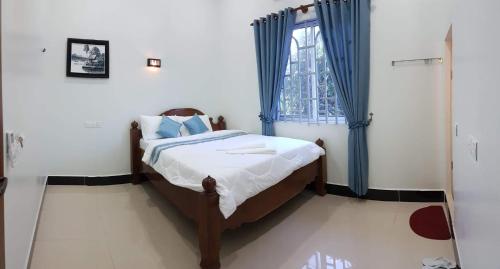 Giường trong phòng chung tại Mama's Family Guesthouse