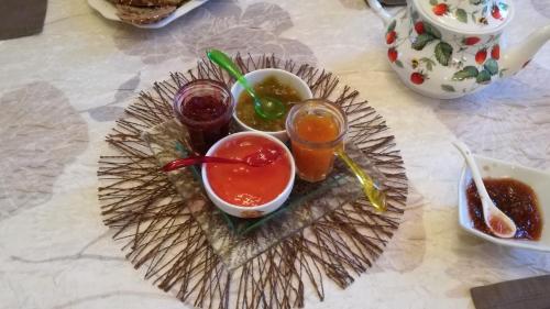 a plate of food with two drinks on a table at Château du Clos Mortier in Saint-Dizier