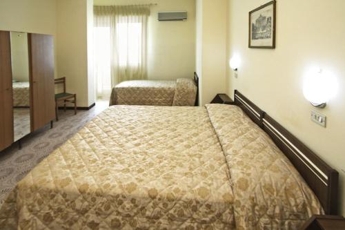 Postel nebo postele na pokoji v ubytování Hotel Blurelda