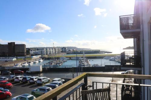 a view of a parking lot with cars parked at Plymouth Flat with Sea Views in Plymouth