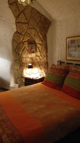 Ένα ή περισσότερα κρεβάτια σε δωμάτιο στο cueva alegria