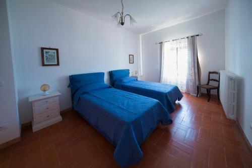 Postel nebo postele na pokoji v ubytování La Vecchia cantina Guzzardi