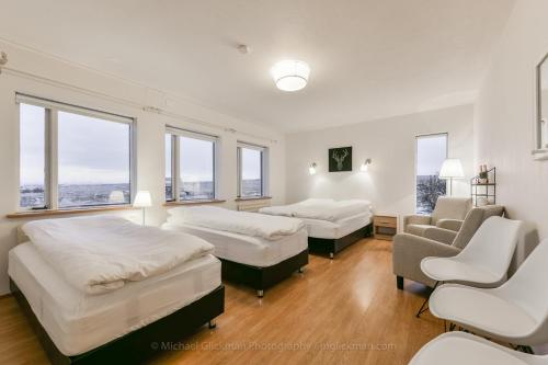 Postel nebo postele na pokoji v ubytování Garður guesthouse