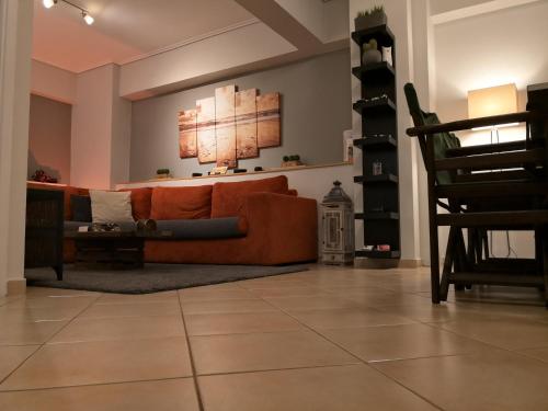 a living room with a couch and a chair at Luxury Home in Spáta