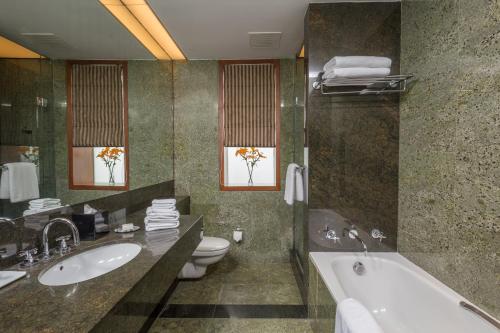A bathroom at The Manor - New Delhi