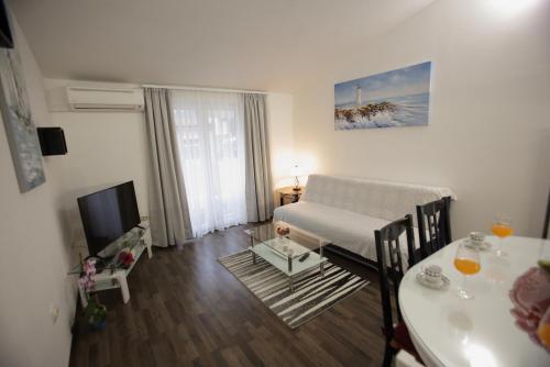 a living room with a couch and a table at Ana Marija in Solin