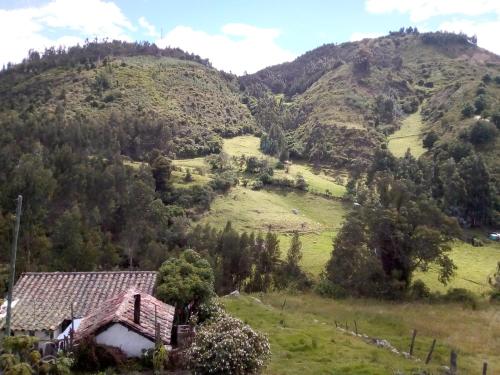 an old house on a hill in the mountains at HOSPEDAJE BELLA VISTA MONGUI in Monguí