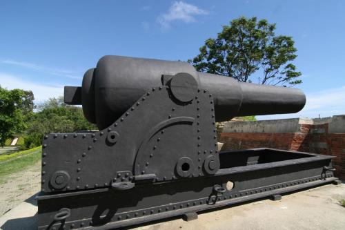 a large cannon on display in a park at 安平72號民宿 in Tainan