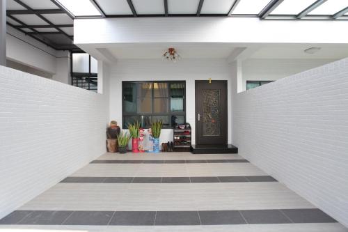 a hallway of a house with a black door at 安平72號民宿 in Tainan