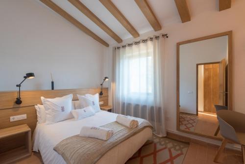 Llit o llits en una habitació de La Piconera (Petit Luxe)