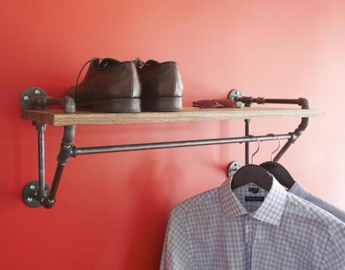 a shelf with a pair of shoes and a shirt at American Dream in New York