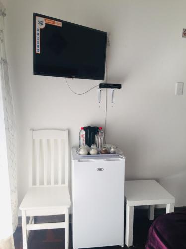 Sinesan Guesthouseにあるキッチンまたは簡易キッチン