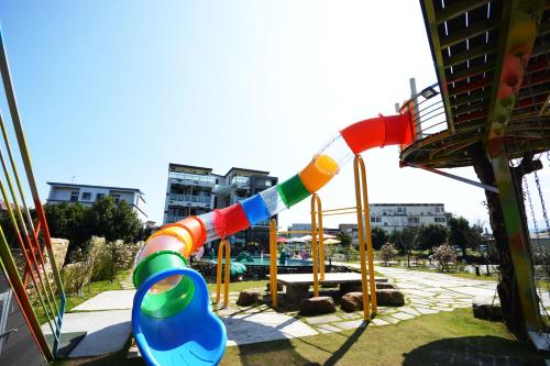 a playground with a water slide in a park at Diudiu Dang Paternity B&B in Dongshan