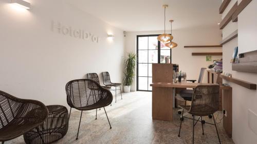 a room with chairs and a table in a room at Hotel d'Or in Cala d´Or