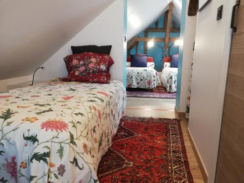 Ένα ή περισσότερα κρεβάτια σε δωμάτιο στο Les Granges de l'Épan