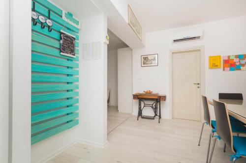 a room with a table and chairs and a wall at Luxury apartment Lucy in center with amazing sea-view in Split