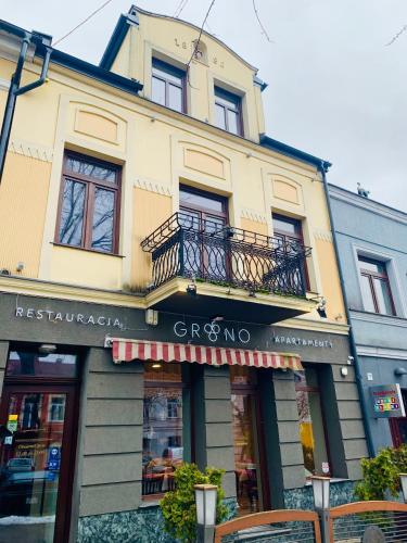 a store front of a building with a balcony at GRONO Apartamenty in Częstochowa
