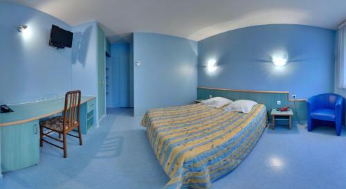 Giường trong phòng chung tại Hotel Restaurant De La Canner