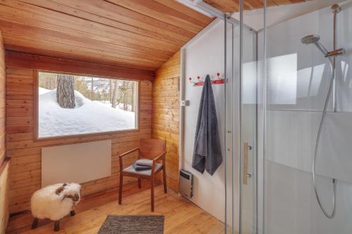 a bathroom with a shower and a sheep at DAS HAUS IM WALD in Seefeld in Tirol