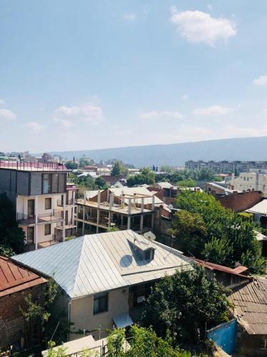 an overhead view of a city with buildings and trees at SaBa Apartments in Old Tbilisi in Tbilisi City