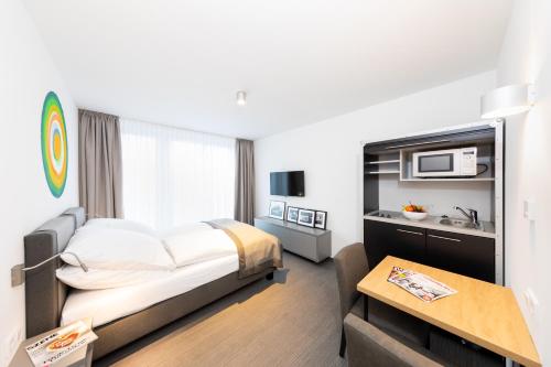 Postel nebo postele na pokoji v ubytování Boardinghouse St.Pauli