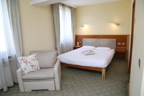 Кровать или кровати в номере Hotel Park Central