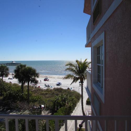 a view of the beach from a balcony of a building at Edison Beach House in Fort Myers Beach