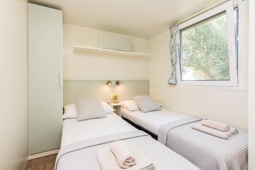 Postel nebo postele na pokoji v ubytování Camp Bepo