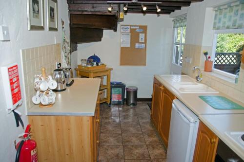 a kitchen with a sink and a counter top at 2 Hope Cottage in Spilsby